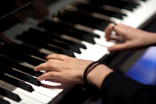 Tegan Quin playing piano in the studio March 2012 - Photo by Lindsey Byrnes