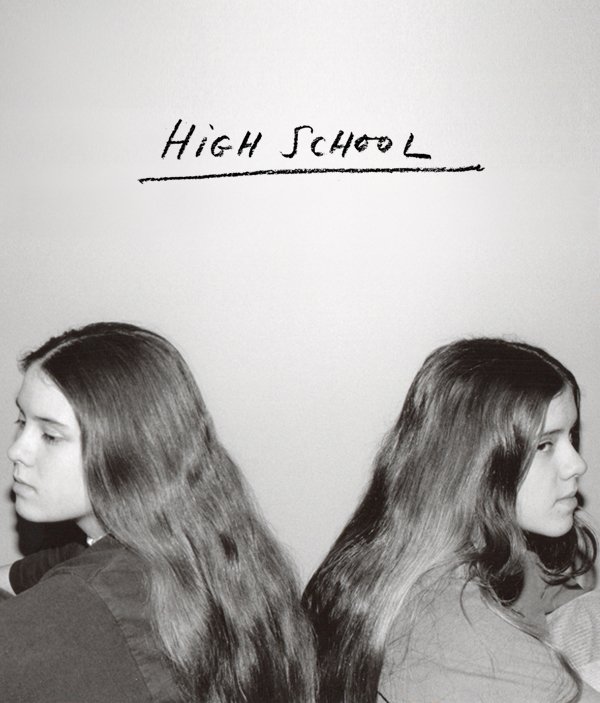 Tegan and Sara high school photo with "High School" in pencil scrawled across the top