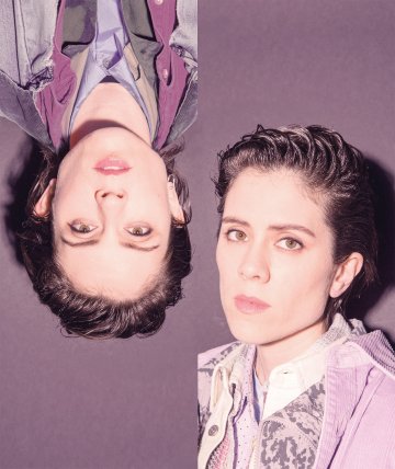 Tegan and Sara on a purple background