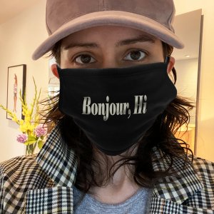 Sara with a "Bonjour, Hi" mask